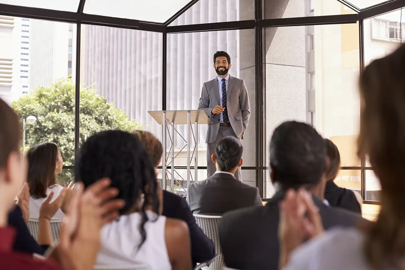 Arrive public speaker at a business seminar